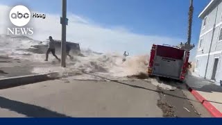 Massive wave in California sweeps people away and floods streets [upl. by Nennarb]