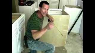 Installing your sink base cabinet Cutting Holes For Plumbing [upl. by Ahsikel581]