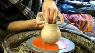 Making throwing a simple flattened clay pottery salt holder on the wheel [upl. by Jona472]