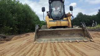 leveling the ground CAT 287b caterpillar [upl. by Dulcle]