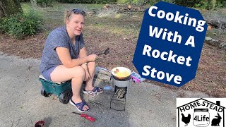 Cooking with a rocket stove [upl. by Anibas554]