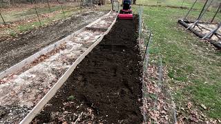 Tilling up the garden with my Wheel Horse C120 tractor [upl. by Mattie]