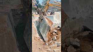 Construction purpose rock block removal with excavator [upl. by Vaios]