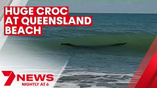 Crocodile spotted swimming at Central Queensland beach  7NEWS [upl. by Travax]