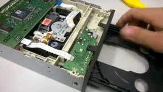 Disassembling a CDDVD Reader  Openning the tray [upl. by Eniamsaj]