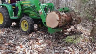 Tractor and grapple  hauling a log back to the mill pile JOHN DEERE 3038E [upl. by Fisch321]