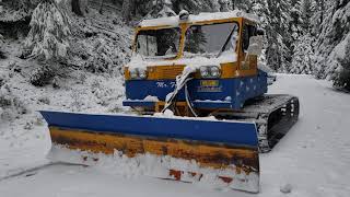 Snowcat plowing the road [upl. by Euqor]