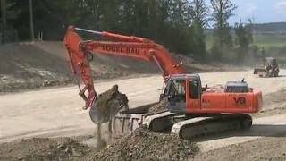 Hitachi Zaxis 350 loading trucks [upl. by Repohtsirhc]