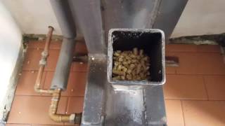 rocket stove Gravity fed pellet burner Heats a 300 ltr water tank [upl. by Assanav416]