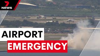 Grass fire ignites near Sydney Airport runway before Qantas flight makes emergency landing  7NEWS [upl. by Nwahsed]