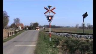 A Danish IC3 train passes railroad crossing nearby Radbjerg [upl. by Neuberger35]