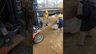 A forklift loads sand into a bag [upl. by Lesnah]