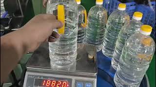 2L bottle test for 8 head edible oil filling capping line [upl. by Alyose]