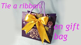 How to make a bow  ribbon bow  bow making  tie a ribbon on gift bag giftbag [upl. by Jandel579]