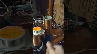 Wireless energy transfer thru air with selfmade tesla coilthe coil is connected to ground [upl. by Nhojleahcim524]