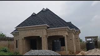 Stone coated steel roofing installation in Nigeria  Black and white shingle design [upl. by Drahcir]