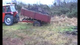 Massey Ferguson 35X  Bogged to the axel with Tipper Trailer [upl. by Neffets]