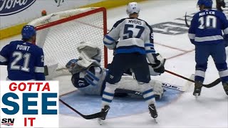 GOTTA SEE IT Jets Hellebuyck Cut By Kucherov Slap Shot To Face [upl. by Annayak354]