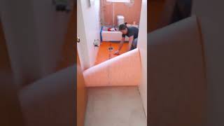 Installing underlayment for tile floor using Ditra short [upl. by Tymes]