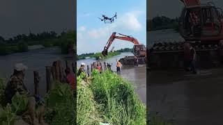 The process of Piling wood piles for river cofferdam [upl. by Wenda]