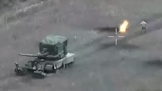 Russian troops flee their tank covered with flames after Ukrainian drone strikes [upl. by Schweiker209]