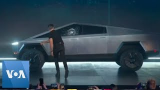 Tesla Suffers Broken Glass Mishap at Launch of New Truck [upl. by Akaenahs]