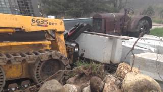 Moving concrete block with Faver grapple [upl. by Akanke442]