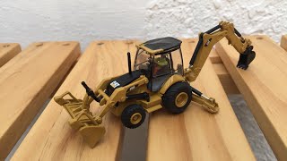 CAT 450E BACKHOE LOADER  DIECAST MASTERS 85263 HO SCALE 187 [upl. by Ahseken]