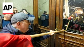 Police in Serbia block protesters from entering Belgrade city council building [upl. by Forrer]