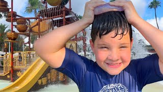 BEST SPLASH PAD PLAYGROUND EVER Caleb PLAYS in the WATER SLIDE with MOM amp DAD Splash Pad for Kids [upl. by Aidole]