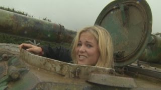 Hilarious reporter crushes cars in tank driving fail [upl. by Renrut]