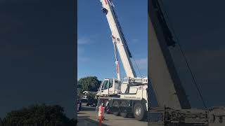 Liebherr LTM 110053 Mobile Crane Lifting and Moving Main Counterweight Onto Flatbed Truck [upl. by Lohcin]