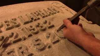 Carving a raised letter inscription into granite for a headstone [upl. by Howenstein896]