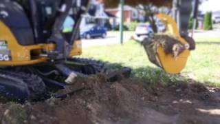 John Deere 35G Mini Excavator Being Used To Scrape Top SoilGrass [upl. by Saitam]