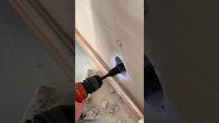 How to install a waste pipe for a kitchen sink Plumber cores a hole with a hilti core drill DIY [upl. by Rhianna]