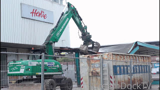 lovely painted Caterpillar M322D excavator demolishing old bus stop [upl. by Reyaht299]