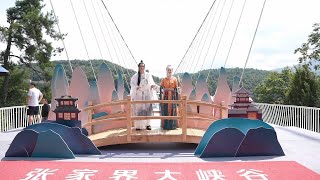 Celebrations held for Qixi Festival on glass bridge in Chinas Zhangjiajie [upl. by Ynnam]