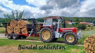 Holzbündel stapeln mit Rückewagen und Schlüter [upl. by Ashwell554]