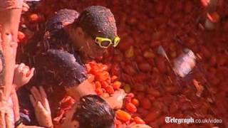 Thousands enjoy annual Tomatina tomato fight festival in Bunol Spain [upl. by Nwahsyd727]