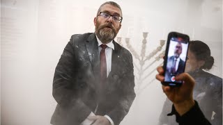 Polish MP thrown out of parliament after dousing Jewish Hanukkah menorah [upl. by Haraf914]