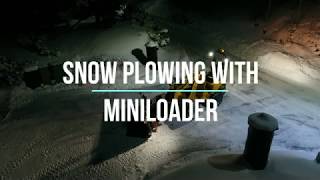 Mini loader snow plowing [upl. by Enaitsirk660]