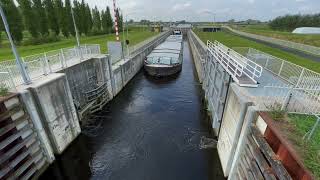 Ship exiting Empel lock Sluis Empel North Brabant Netherlands no sound [upl. by Nauq963]