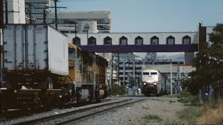 Amtraks California Zephyr 5 passes UP trailer train at street level in Reno NV [upl. by Gelya775]