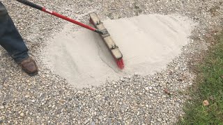 brushing CHEAP concrete onto a gravel driveway adding strength and resilience [upl. by Naahsar]