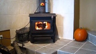 Installing a wood stove in a brick chimney Part 2 Connecting and lighting it [upl. by Graehl]