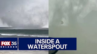 Impressive waterspout spins from beach to the ocean [upl. by Irtimd]