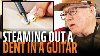 Fixing a guitar dent by steaming it out [upl. by Acemaj]