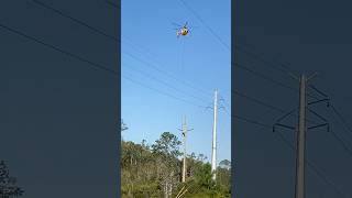 Aerial lineman hanging below helicopter Dangerous Job  dangerous lineman dangerousjobs job [upl. by Neersin]