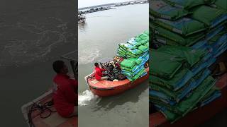 With the help of this boat this man loads sacks of salt and takes them to the ships [upl. by Carley]