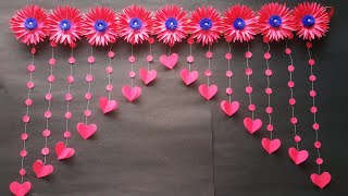 Paper flowers door HangingDoor hanging craft ideas [upl. by Aenotna814]